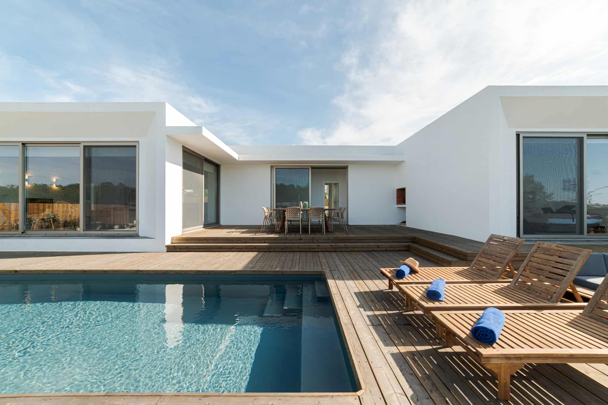 lounge-chairs-in-modern-villa-pool.jpg